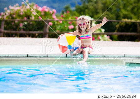 Child in swimming pool on summer vacation Child in swimming pool on summer vacation 29662934
