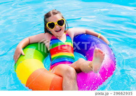 Child with toy ring in swimming pool 29662935