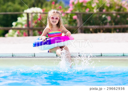 Child with toy ring in swimming pool 29662936