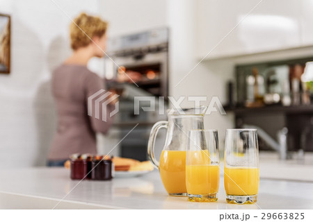 Woman cooking healthy breakfast in kitchen 29663825