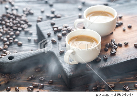 Two cups of coffee with coffee beans Two cups of coffee with coffee beans 29664047