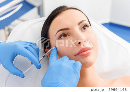 Serene woman receiving cosmetic procedure Serene woman receiving cosmetic procedure 29664148