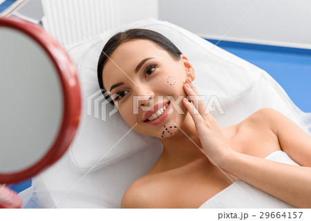 Happy female with correction marks watching at 29664157