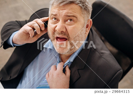Exhausted businessman experiencing a heat collapse Exhausted businessman experiencing a heat collapse 29664315