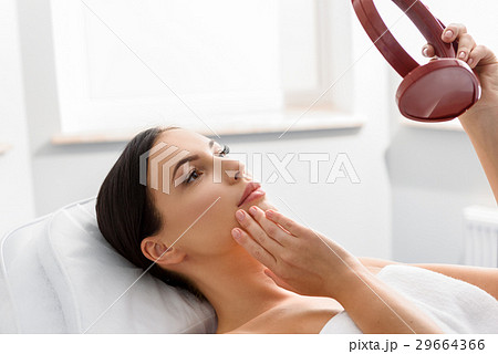 Female watching at reflexion in clinic 29664366