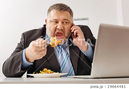 Hungry tired company employee overloaded with work Hungry tired company employee overloaded with work 29664481