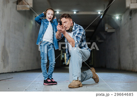 Serious attractive man aiming at the target Serious attractive man aiming at the target 29664685