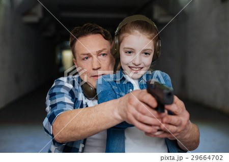 Nice handsome man directing his daughter Nice handsome man directing his daughter 29664702