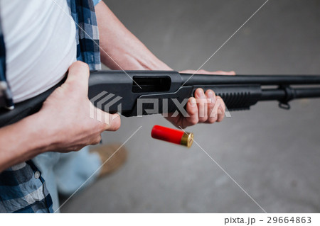 Red riffle bullet dropping out of the gun Red riffle bullet dropping out of the gun 29664863