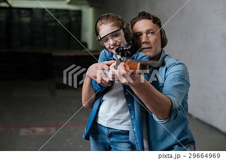Cheerful positive girl trying to shoot 29664969