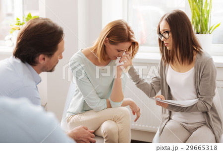 Disappointed woman bowing her head Disappointed woman bowing her head 29665318