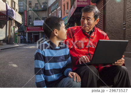 Asian family in front of store Asian family in front of store 29673527