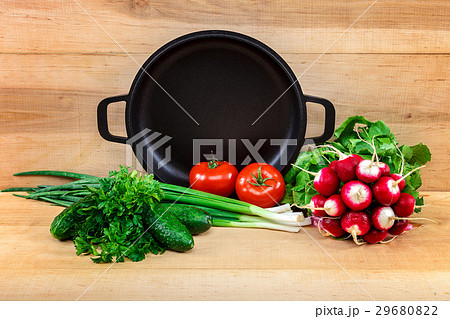 Fresh vegetables and pan on a wooden background 29680822