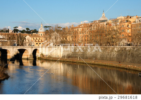 cathedral over bridge and river water at fall day 29681618