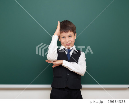 Schoolboy and the school board, learning concept Schoolboy and the school board, learning concept 29684323