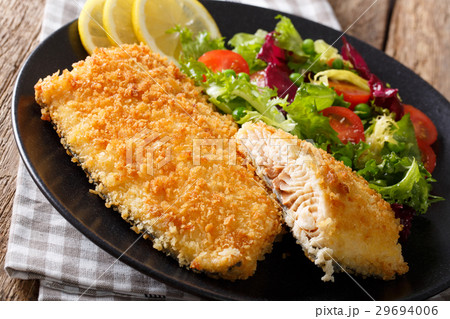 Fried fish fillet in breading and fresh vegetable 29694006