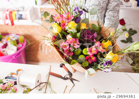 Florist making a bouquet Florist making a bouquet 29694361