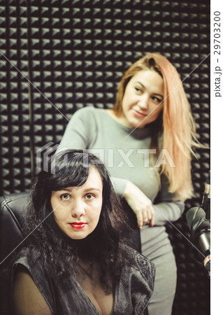 the girl at the microphone in the Studio the girl at the microphone in the Studio 29703200