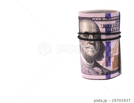 Rolled into a tube of  dollars banknotes 29703837