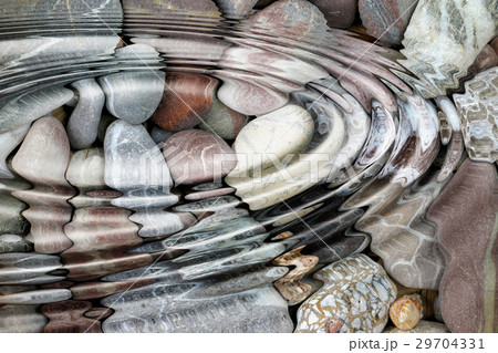 Water ripples over the stone pebbles 29704331