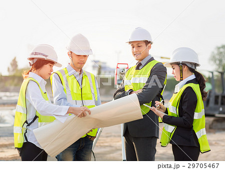 Asian construction engineer checking blueprint 29705467