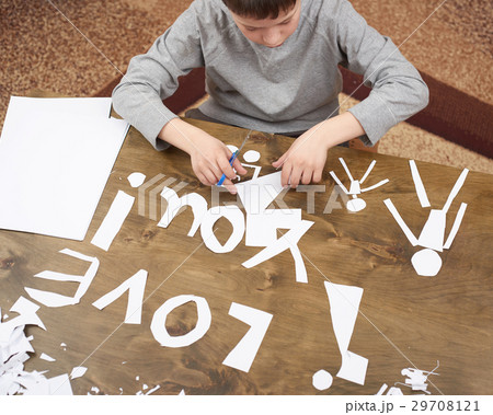 boy makes origami - car and family, children boy makes origami - car and family, children 29708121