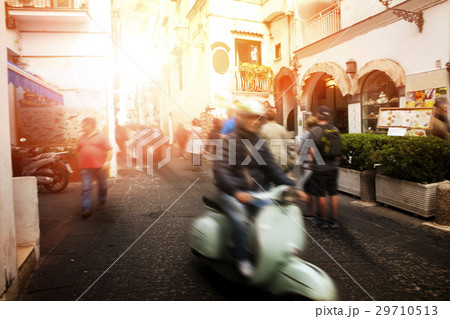 man riding scooter motorcycle in amalfi italy 29710513