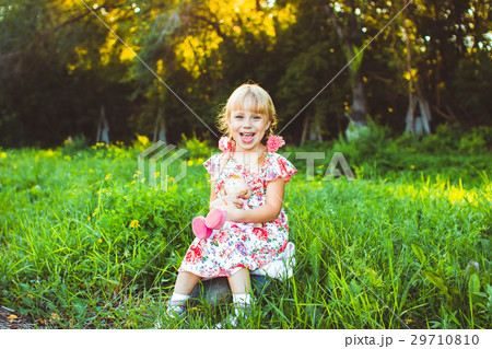 little girl in green grass 29710810