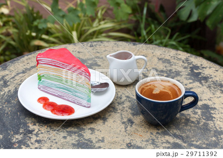 crape cake rainbow and hot espresso coffee 29711392