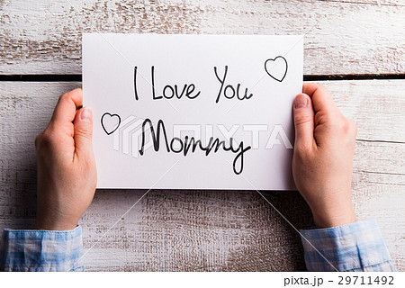 Mothers day composition. Hands holding note Mothers day composition. Hands holding note 29711492