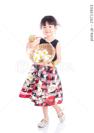 girl holding basket with flower over white  29713603