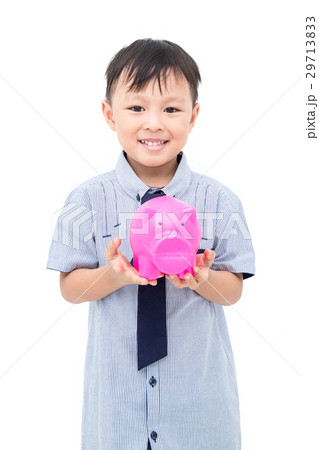 Young boy holding piggy bank over white background Young boy holding piggy bank over white background 29713833