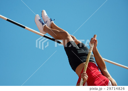 Athlete pole vault with a blue sky 29714826