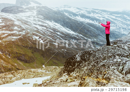 Tourist taking photo from Dalsnibba, Norway 29715198