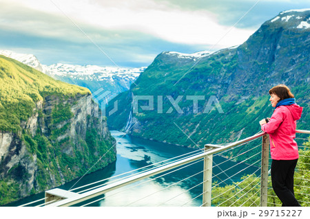Tourist taking photo, Flydasjuvet viewpoint Norway Tourist taking photo, Flydasjuvet viewpoint Norway 29715227