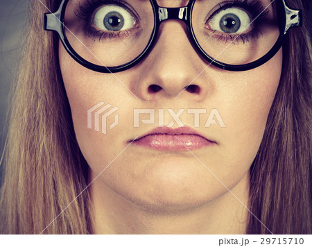 Closeup woman shocked face with eyeglasses 29715710