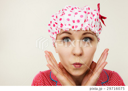 Funny woman wearing pajamas and bathing cap 29716075