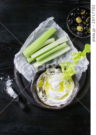 Fresh celery with yogurt dip Fresh celery with yogurt dip 29717702