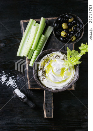 Fresh celery with yogurt dip 29717703