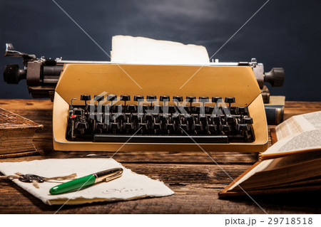 old typewriter, a pile of books old typewriter, a pile of books 29718518