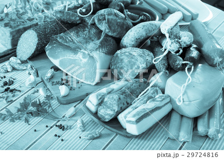 Variety of meats and sausages on table 29724816