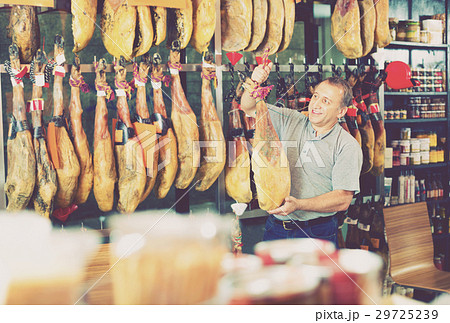 Customer buying iberico or serrano jamon leg 29725239