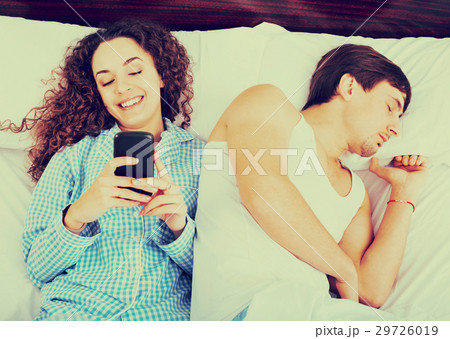 Girlfiend chatting on smartphone 29726019