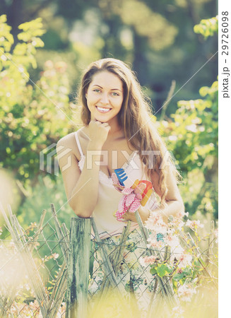 Smiling girl in garden Smiling girl in garden 29726098