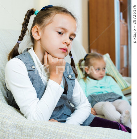 Portrait of two little upset miserable girls having conflict 29726176