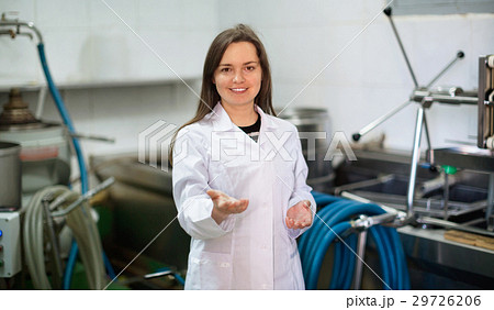 Portrait of female engineer near olive pressing engine Portrait of female engineer near olive pressing engine 29726206