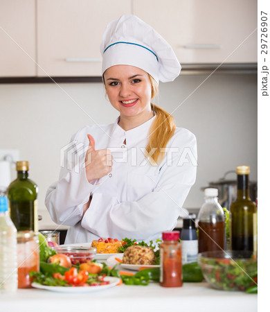 Happy cook preparing vegetable salad with cheese Happy cook preparing vegetable salad with cheese 29726907