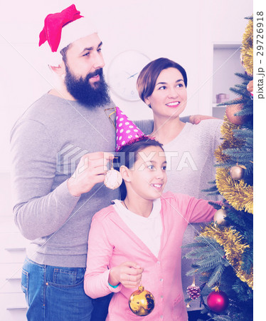 Family decorating Christmas tree Family decorating Christmas tree 29726918
