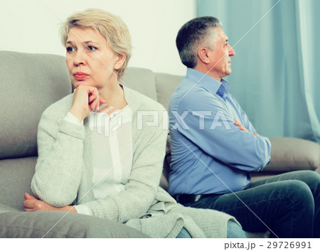 sad middle-aged couple quarreling at home with each other 29726991