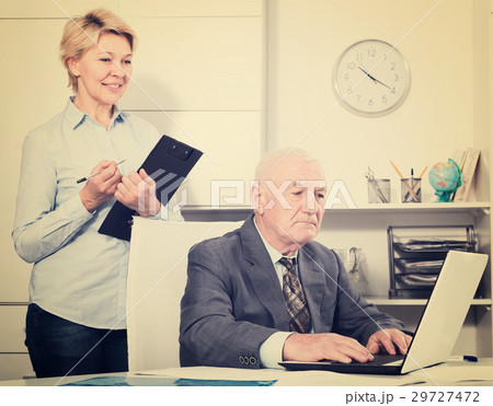 Aged manager working with secretary 29727472